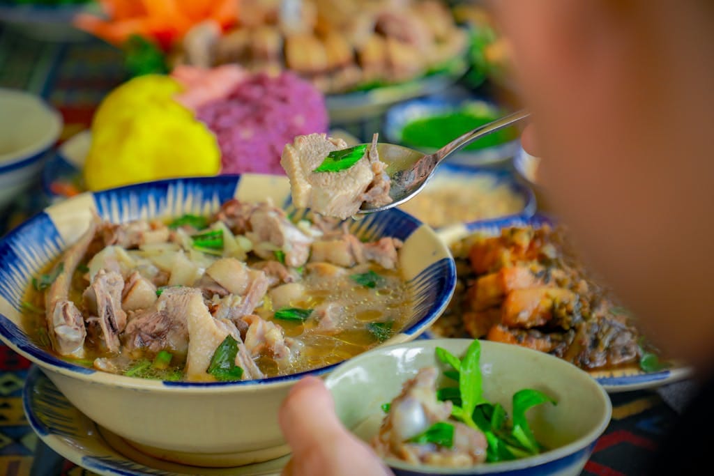 Delicious traditional Vietnamese duck soup with bamboo shoots served in a vibrant setting, showcasing authentic cuisine.
